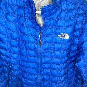 The North Face Blue Puffer Jacket- (Patch on right sleeve)